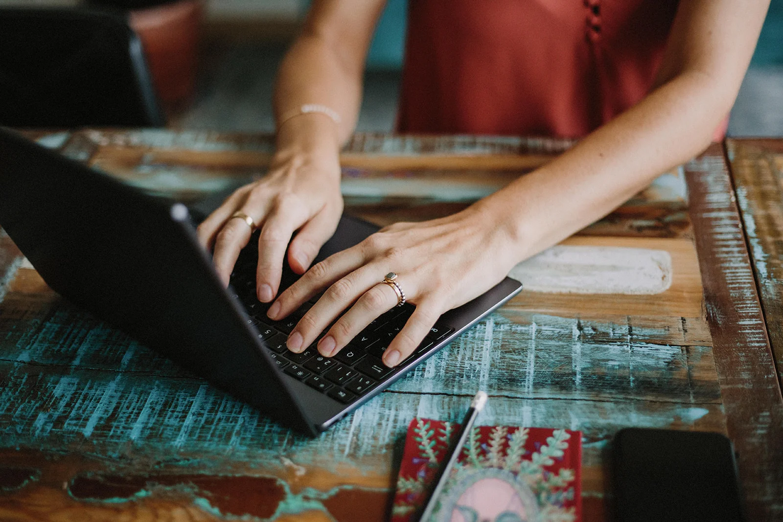 Hands typing on a laptop — flexible individual coaching calls by audio