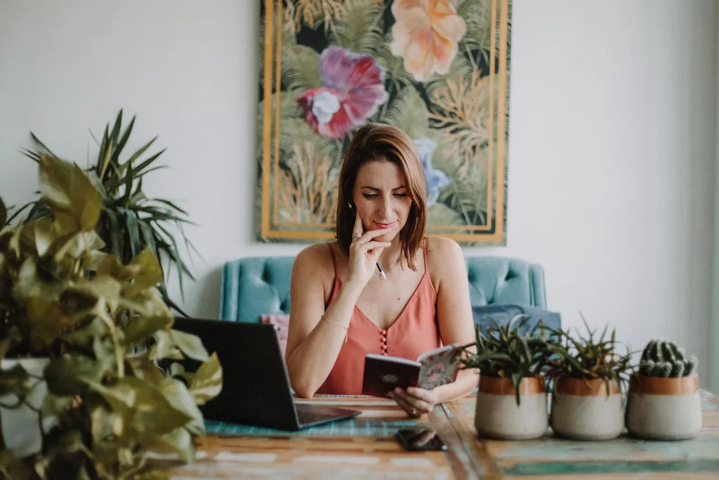 Bianca Topham, stress and burnout coach, planning a coaching session with a notebook